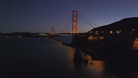 golden gate bridge san francisco california aerial drone sunset sunrise evening purple sky dusk bay area lime point lighthouse point cavillo lights sausalito dana bowers needles forward pan motion