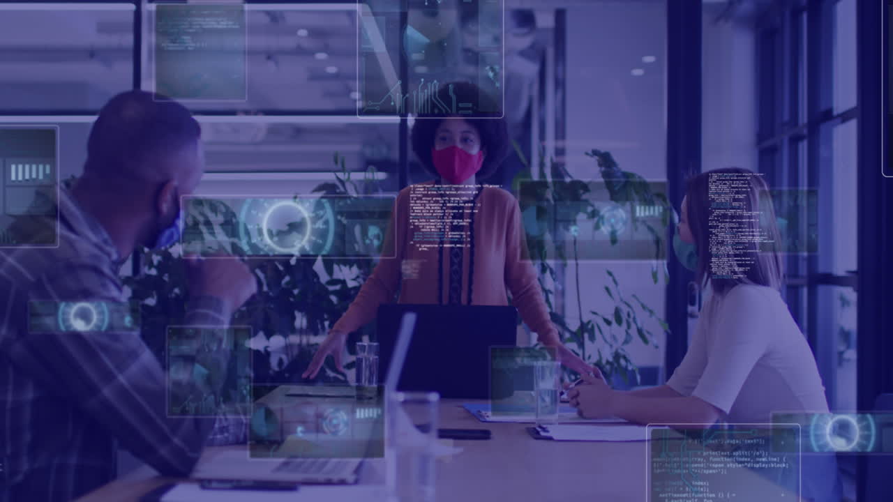 Animation of digital screens over diverse business people wearing face masks during meeting
