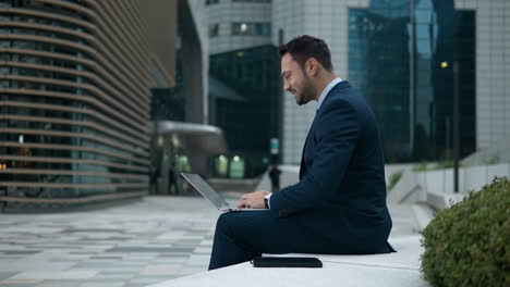 video conferencing - businessman waving hand on laptop during meeting in seoul, south korea