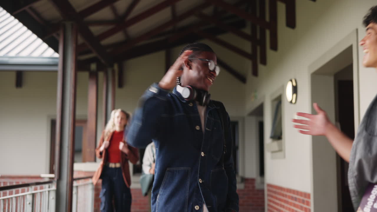 Students greeting each other in a school hallway