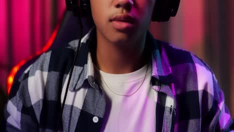 close up of asian teen boy gamer lose while playing video game on computer
