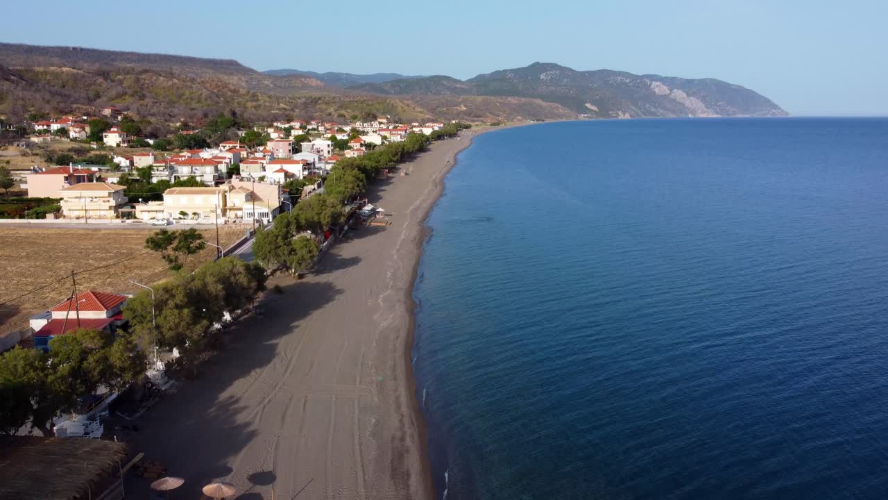 Longest and secluded Greek island Vatera beach beautiful landscape surrounding the sea and mountains, Lesvos Island, Drone view