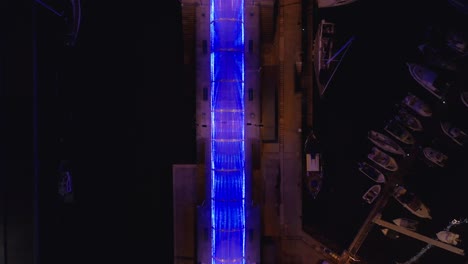 light art tunnel with flashing pattern in different colors shapes at marina in funchal, aerial