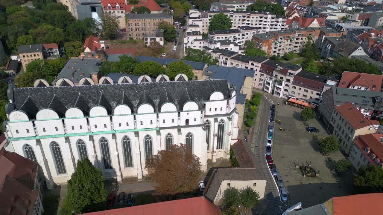 Dome to halle in the city in germany is shining on a sunny summer day. Magic aerial view flight drone shot footage from above