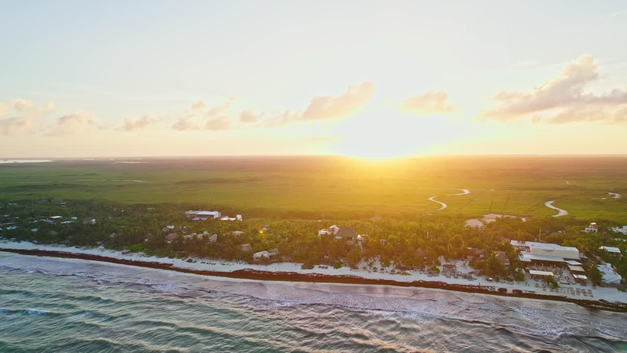 Drone Footage Of Beautiful Golden Hour Sunset Shining Over Tropical Jungle Beach In Tulum Mexico.