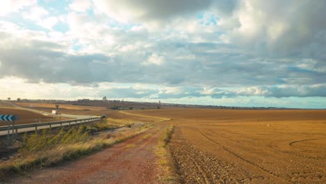 timelapse near a village in extremeadura, spain, over the fields and rainy clouds passing by