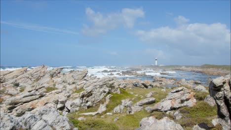 slow pan of cape hangklip lighthouse and beautiful rocky landscape