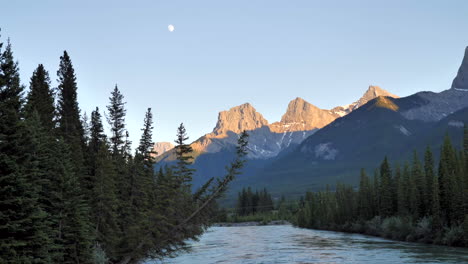 mountain sky over rushing river at dusk