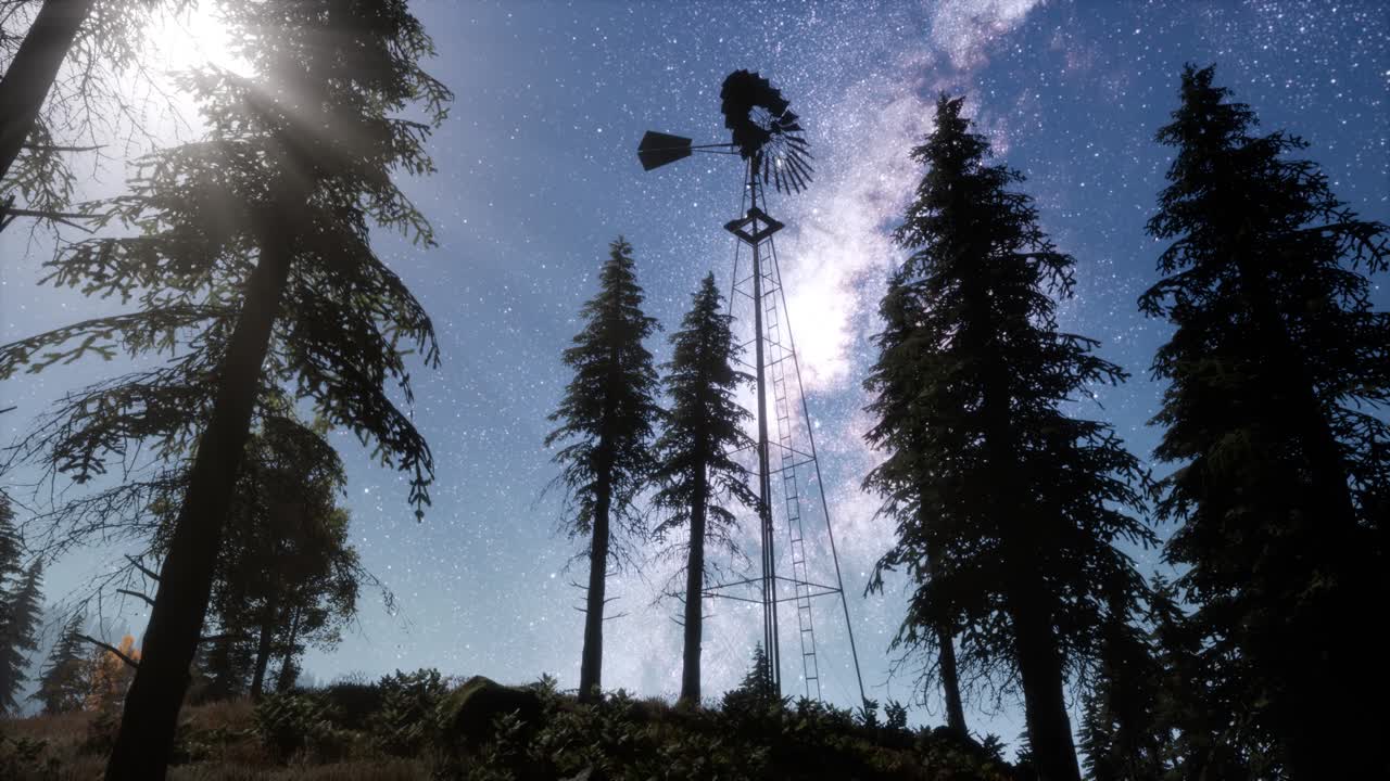 retro windmill in mountain forest with stars. hyperlapse