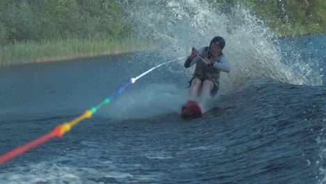 Man-jumps-boat-wake-on-skyski-air-chair