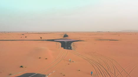 4k drone footage, a road between desert, dubai’s half desert road, geological landscape of high dune desert in the united arab emirates, drone videos