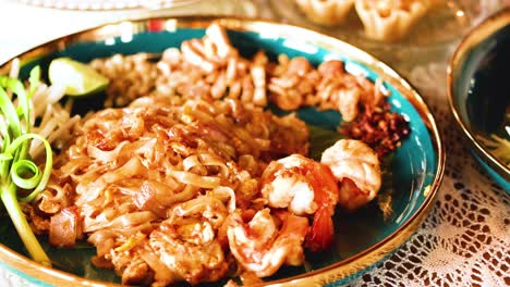 a vibrant dish of pad thai with shrimp