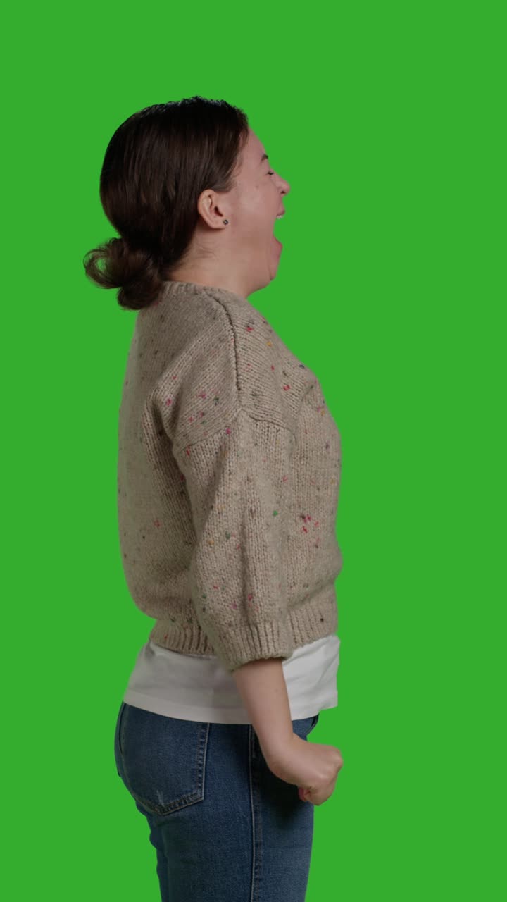 Vertical video: Profile of close up young adult acting tired and sleepy on camera