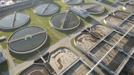 aerial orbit over the clarifier tanks and aeration basins in huge water clarifying plant