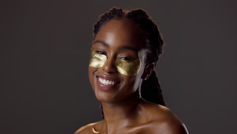woman with gold eye patches