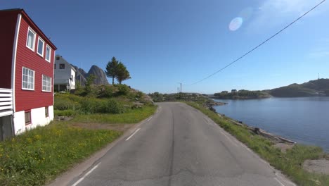 driving a car on a road in norway lofoten reine