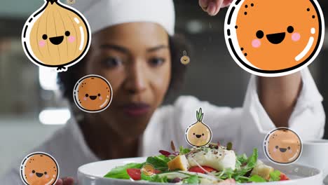 animation of fruit and vegetables icons over african american female chef preparing dish