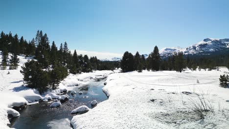 Aerial-view-of-West-Fork-Carson-River-in-Hope-Valley,-California-in-winter