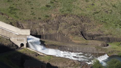 flip bucket at the end of hydro dam spillway dissipates erosive force