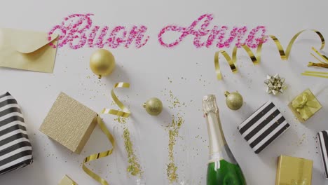 animación de texto de feliz año nuevo sobre botella de champán y artículos de fiesta.