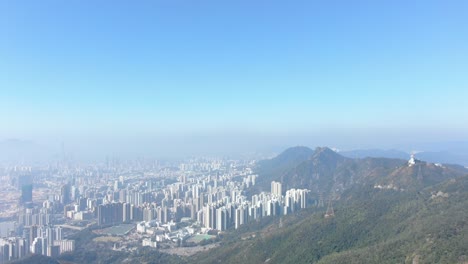 Hong-Kong-bay-and-skyline-with-skyscrapers,-high-altitude-wide-shot