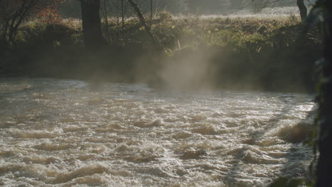 north york moors, river esk in full flow flood, mist on water late summer, autumn time, slow motion - clip 16