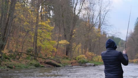 a man fishing on a mountain river fishing concept a man fishing on a mountain river fishing concept