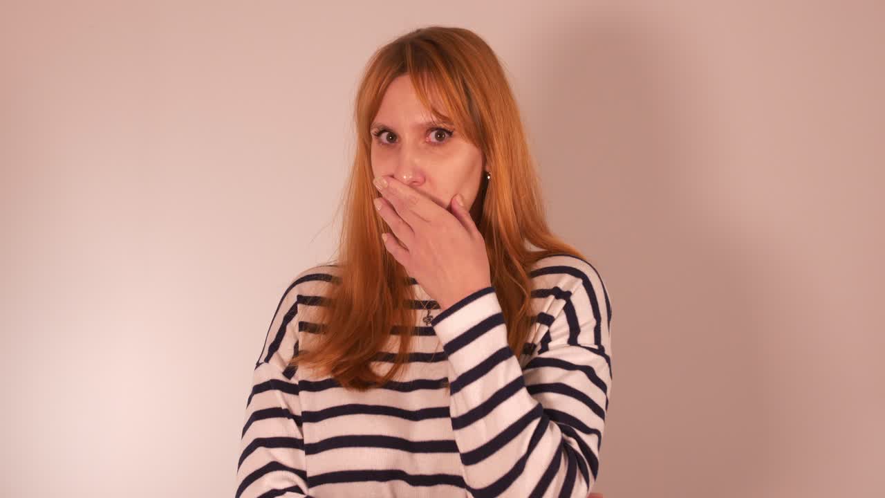 Beautiful girl dramatizing an awkward situation,