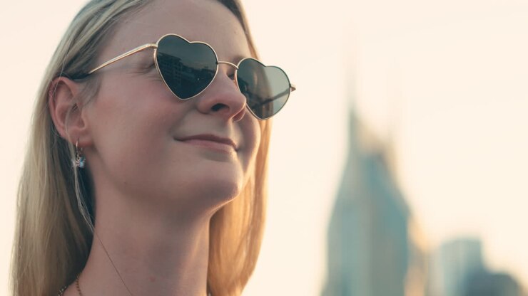 Woman with Heart Necklace and &quot;I Voted&quot; Badge