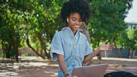 woman having a video call in a park