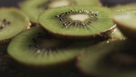 Micro-video-of-close-up-of-kiwi-fruit-slices-with-copy-space