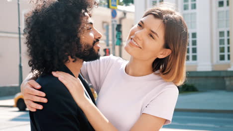 happy couple hugging outdoors