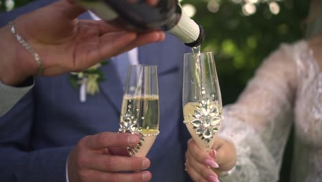 a man and a woman pour champagne into glasses