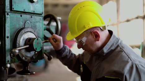 man checking machinery