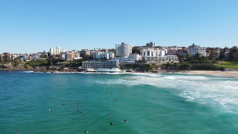 Surfers-Floating-In-Turquoise-Ocean-Water-At-Bondi-Beach,-Sydney,-New-South-Wales