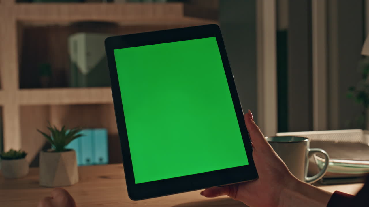 Girl fingers zooming mockup tablet watching photos at evening home close up