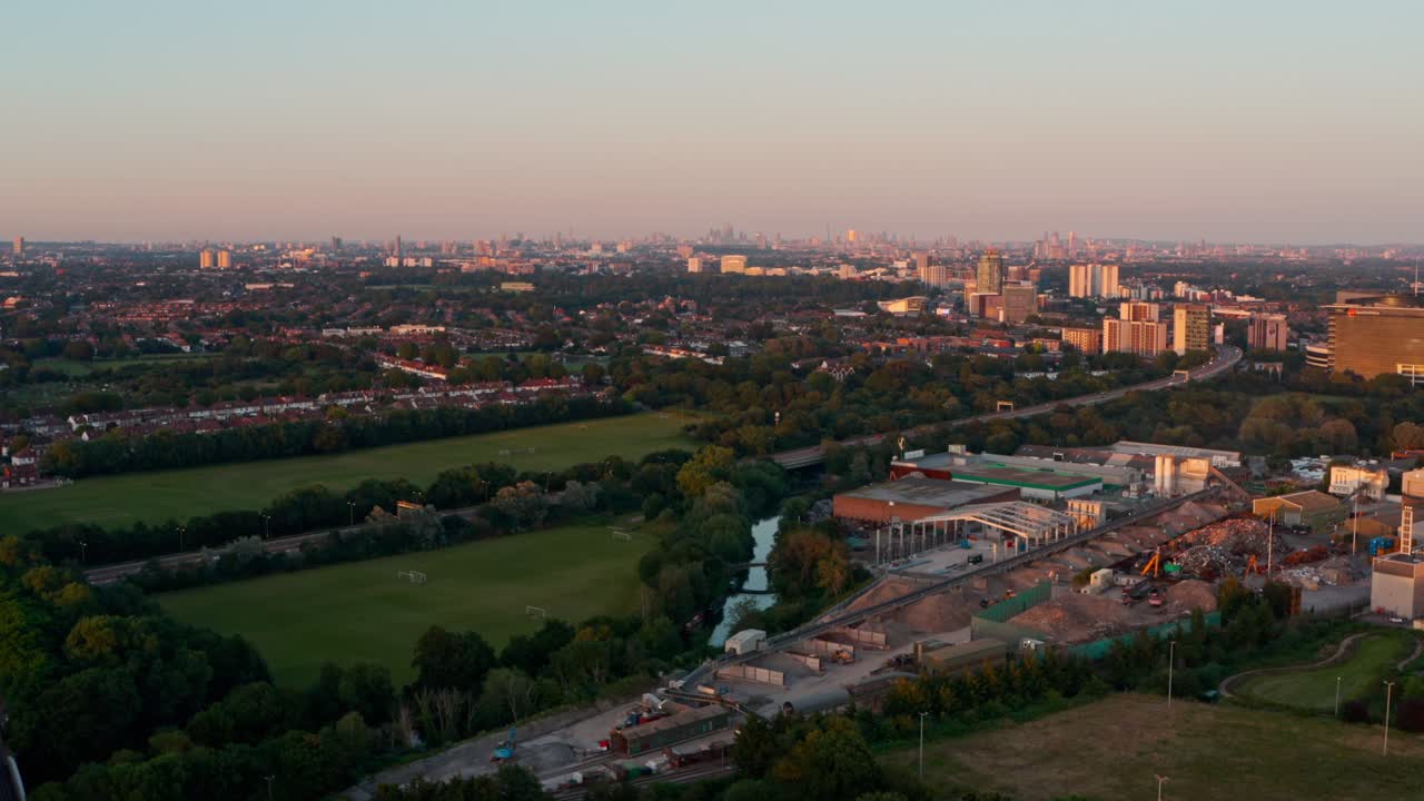 Dolly forward drone shot towards Central London skyline from the West at sunset