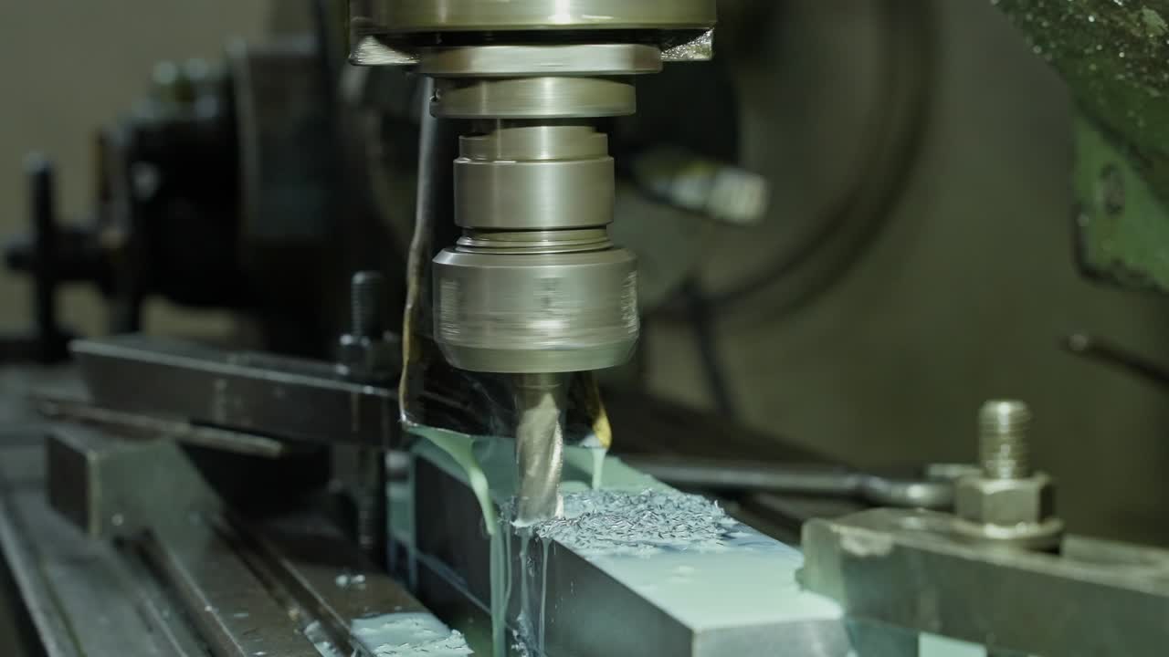 precision milling machine carving metal block with fluid cooling system