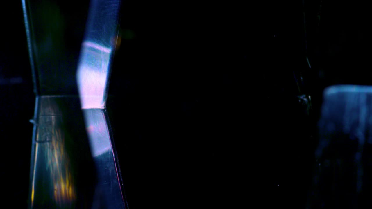 prisma cristal refracción de la luz de fondo bucle de textura arco iris en 4k