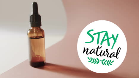 animation of stay natural text and leaf logo over organic beauty oil dropper bottle