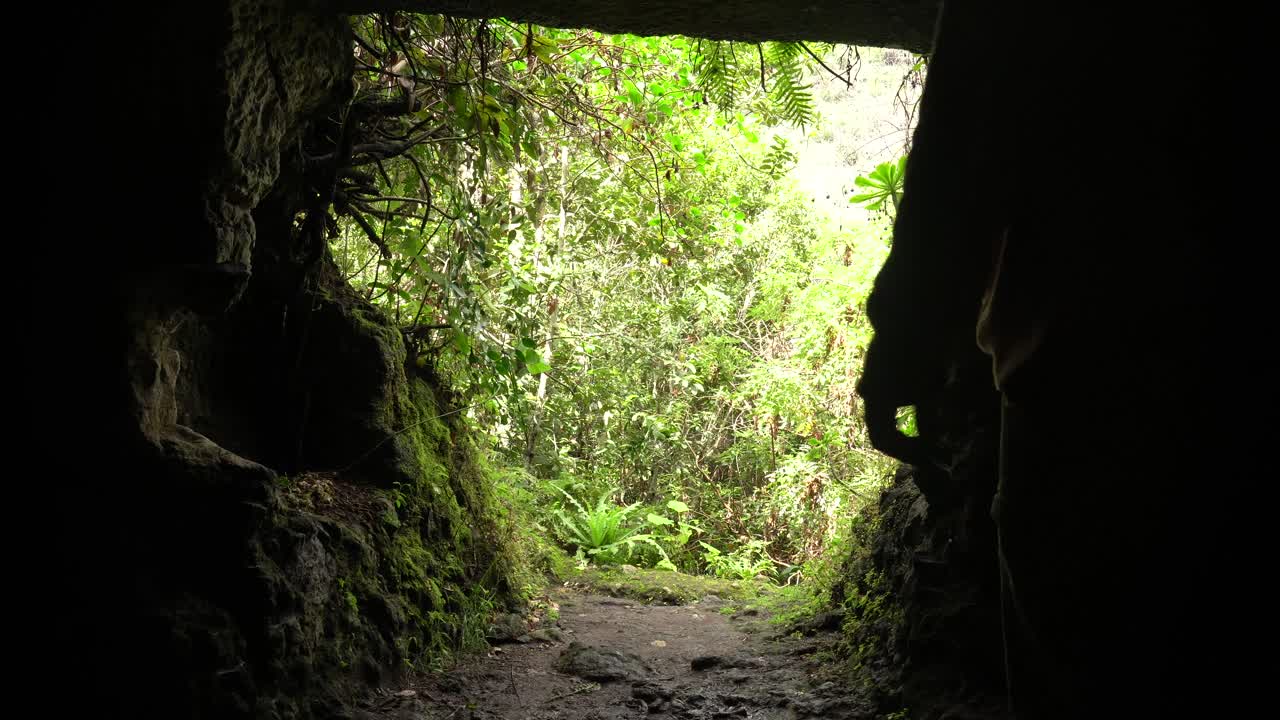 Silhouette of a person in a cave entrance