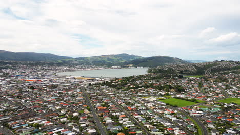 Establishing-Aerial,-Drone-view-over-Dunedin-in-New-Zealand