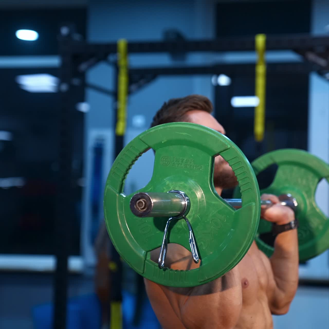 Bodybuilder doing weightlifting at gym