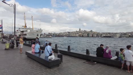 people on the waterfront in istanbul, turkey