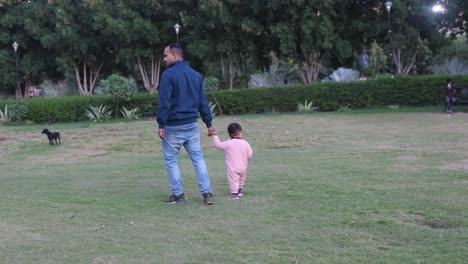 father and son walking and spending quality time together at outdoor at evening