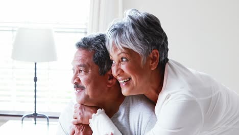 senior couple embracing each other in bedroom 4k