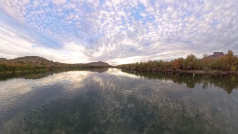 kayaking on a desert river at sunset