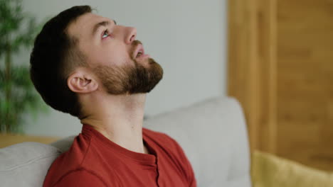 Sick-man-sitting-in-the-living-room