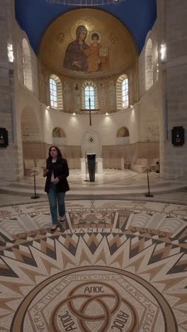 tourist immersed in the atmosphere of dormition abbey. slow motion.