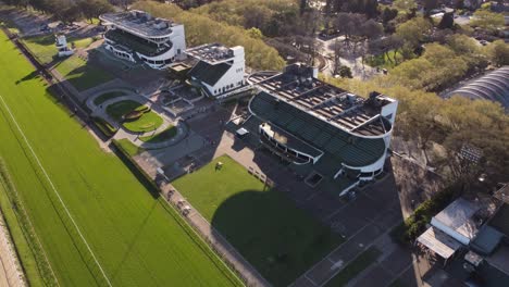 aerial flyover beautiful fancy stalls of horse race stadium in buenos aires,4k